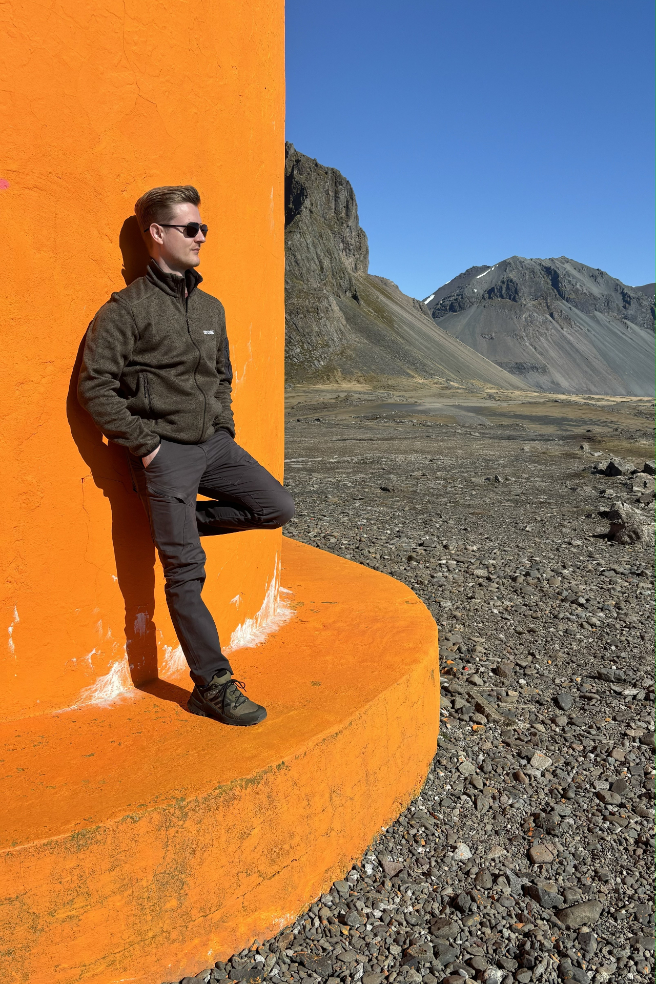 Vojtěch Skala by a vivid orange structure in Iceland